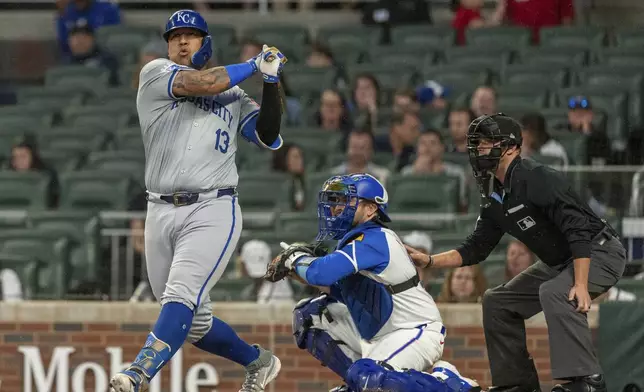 Kansas City Royals' Salvador Perez (13) swings at a pitch called a strike in the first inning of a baseball game against the Atlanta Braves, Saturday, Sept. 28, 2024, in Atlanta. (AP Photo/Jason Allen)