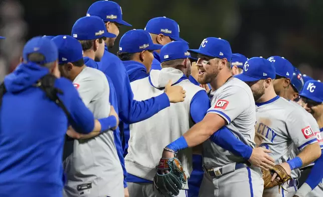 Kansas City Royals outfielder Hunter Renfroe, center, celebrates with teammates following Game 2 of an AL Wild Card Series baseball game against the Baltimore Orioles, Wednesday, Oct. 2, 2024 in Baltimore. The Royals won 2-1. (AP Photo/Stephanie Scarbrough)