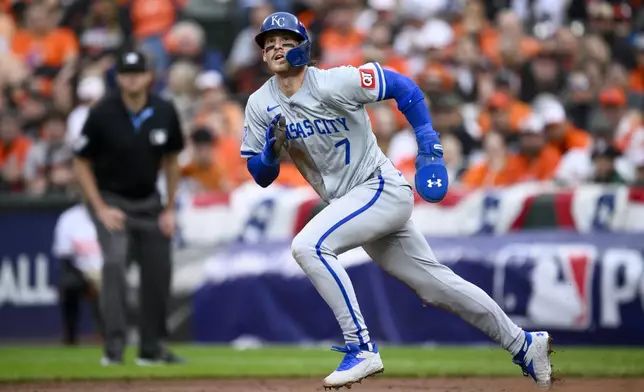 Kansas City Royals' Bobby Witt Jr. runs from first to third base on a single by Salvador Perez during the third inning in Game 2 of an AL Wild Card Series baseball game against the Baltimore Orioles, Wednesday, Oct. 2, 2024 in Baltimore. (AP Photo/Nick Wass)