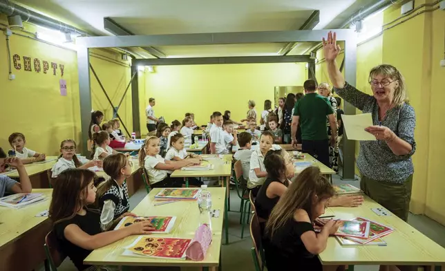 Classes continue underground at Gymnasium No. 6 despite an air alert in Zaporizhzhia, Ukraine, Sept. 3, 2024. Missiles and bombs strike daily, so the city has begun on a dozen subterranean schools designed to be radiation- and bomb-proof. (AP Photo/Evgeniy Maloletka)