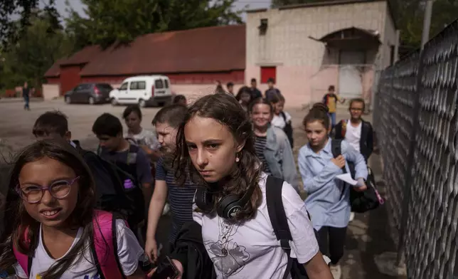 Children go to the school basement to continue their studies during an air alert in Zaporizhzhia, Ukraine, Sept. 3, 2024. (AP Photo/Evgeniy Maloletka)