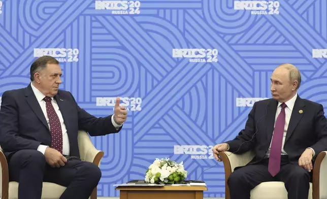 Russian President Vladimir Putin and Bosnian Serb political leader Milorad Dodik attend a meeting on the sidelines of the BRICS Summit in Kazan, Russia, Friday, Oct. 25, 2024. (Alexander Kazakov, Sputnik, Kremlin Pool Photo via AP)