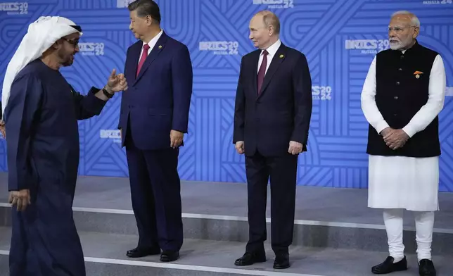 From left: United Arab Emirates President Sheikh Mohammed bin Zayed Al Nahyan, Chinese President Xi Jinping, Russian President Vladimir Putin and Indian Prime Minister Narendra Modi attend a family photo ceremony prior to the BRICS Summit plenary session in Kazan, Russia, Wednesday, Oct. 23, 2024. (AP Photo/Alexander Zemlianichenko, Pool)