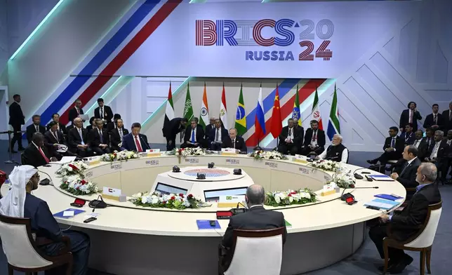 Russian President Vladimir Putin, Indian Prime Minister Narendra Modi, Egyptian President Abdel Fattah el-Sisi, Iranian President Masoud Pezeshkian, Brazilian Foreign Minister Mauro Vieira, United Arab Emirates President Sheikh Mohammed bin Zayed Al Nahyan, South African President Cyril Ramaphosa and Chinese President Xi Jinping attend the BRICS Summit narrow format session in Kazan, Russia, Wednesday, Oct. 23, 2024. (Alexander Nemenov, Pool Photo via AP)