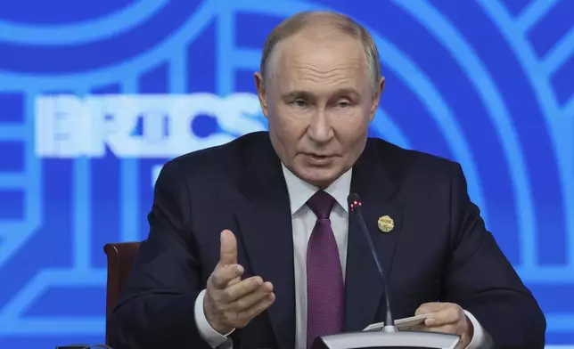 Russian President Vladimir Putin holds a press conference at BRICS Summit in Kazan, Russia, Thursday, Oct. 24, 2024. (Maxim Shipenkov, Pool Photo via AP)