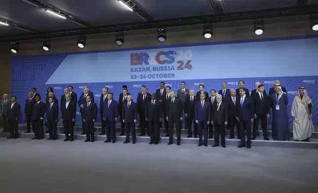 The heads of delegations pose for a family photo prior to Outreach/BRICS Plus format session at the BRICS Summit in Kazan, Russia, Thursday, Oct. 24, 2024. (Maxim Shipenkov, Pool Photo via AP)