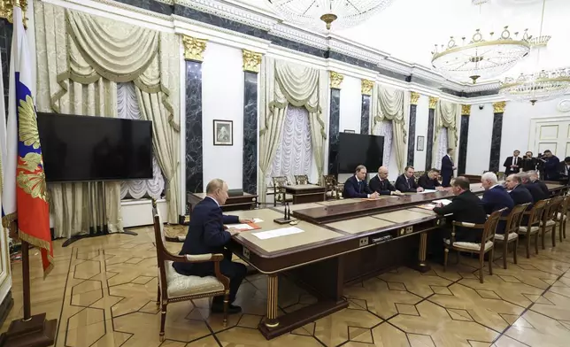 FILE - Russian President Vladimir Putin, left, speaks at the Security Council meeting on nuclear deterrence at the Kremlin in Moscow, Russia, on Sept. 25, 2024. (Alexander Kazakov, Sputnik, Kremlin Pool Photo via AP, File)