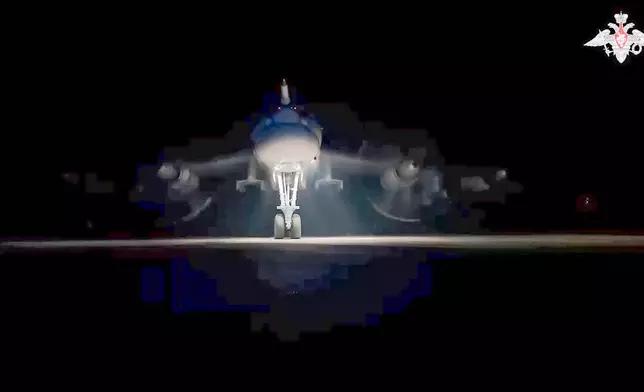 In this photo taken from video distributed by Russian Defense Ministry Press Service on Tuesday, Oct. 29, 2024, A nuclear-capable Tu-95 strategic bomber of the Russian air force prepares for takeoff as part of drills of Russia's strategic nuclear forces. (Russian Defense Ministry Press Service via AP)