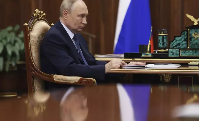 Russian President Vladimir Putin speaks with Head of Federal Customs Service Valery Pikalyov at the Kremlin in Moscow, Russia, Friday, Oct. 25, 2024. (Mikhail Metzel, Sputnik, Kremlin Pool Photo via AP)