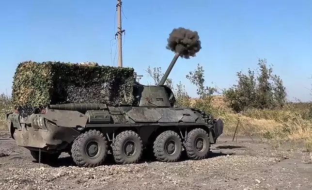 In this photo released by Russian Defense Ministry Press Service on Thursday, Oct. 17, 2024, a Russian self-propelled mortar Nona-SVK fires towards Ukrainian positions at an undisclosed location in Ukraine. (Russian Defense Ministry Press Service via AP)