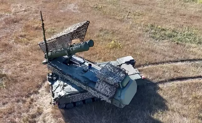 In this photo taken from video released by Russian Defense Ministry Press Service on Monday, Sept. 30, 2024, the Buk-3M self-propelled, medium-range surface-to-air missile system prepares to fire at an undisclosed location in Ukraine. (Russian Defense Ministry Press Service via AP)