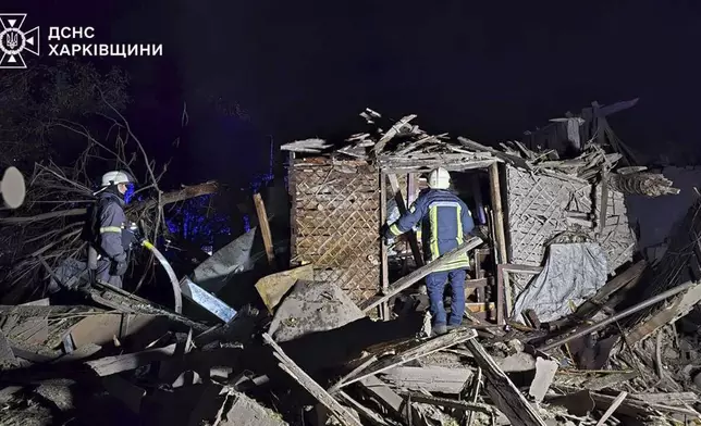 In this photo provided by the Ukrainian Emergency Service on Oct. 21, 2024, rescue workers clear the rubble of a house destroyed by a Russian strike in Kharkiv, Ukraine. (Ukrainian Emergency Service via AP)