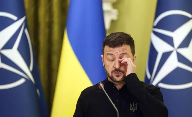 Ukrainian President Volodymyr Zelenskyy speaks to journalists during a joint press conference with NATO Secretary General Mark Rutte in Kyiv, Ukraine, Thursday Oct. 3, 2024. (AP Photo/Evgeniy Maloletka)