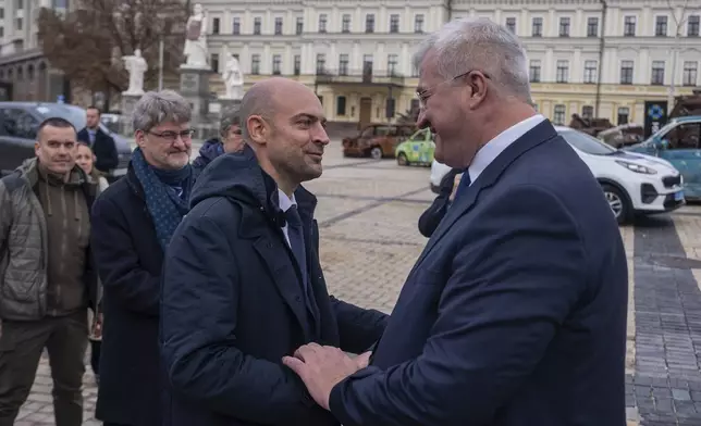 French Foreign Minister Jean-Noel Barrot shakes hands with Ukrainian Foreign Minister Andrii Sybiha in central Kyiv, Ukraine, Saturday, Oct. 19, 2024. (AP Photo/Alex Babenko)