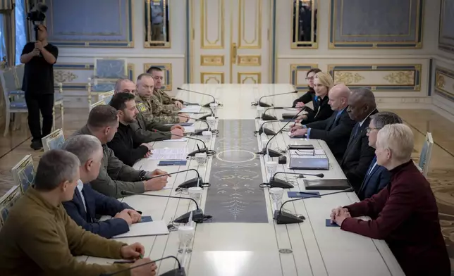 In this photo provided by the Press Service Of The President Of Ukraine on October 21, 2024, U.S. Secretary of Defense Lloyd Austin, centre right, and Ukraine's President Volodymyr Zelenskyy, centre left, attend their meeing in Kyiv, Ukraine. (Press Service Of The President Of Ukraine via AP)