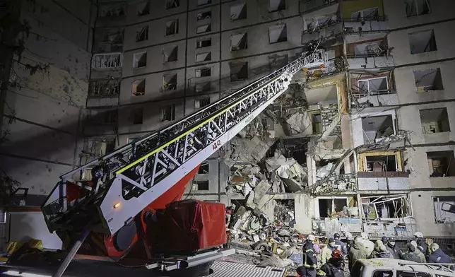 In this photo provided by Kharkiv City Administration a multi-storey apartment building is seen damaged by Russian attack in Kharkiv, Ukraine, late Wednesday, Oct. 30, 2024. (Kharkiv City Administration via AP)