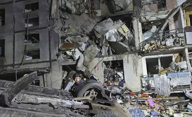 In this photo provided by Kharkiv City Administration a multi-storey apartment building is seen damaged by Russian attack in Kharkiv, Ukraine, late Wednesday, Oct. 30, 2024. (Kharkiv City Administration via AP)