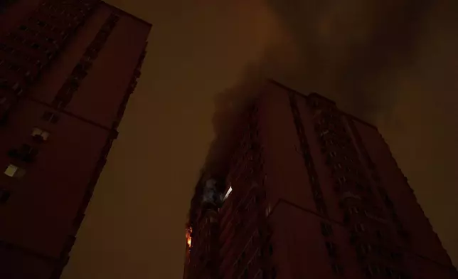 A residential building burns after an attack of Russian drones killed a teenager in Kyiv, Ukraine, Friday, Oct. 25, 2024. (AP Photo/Alex Babenko)