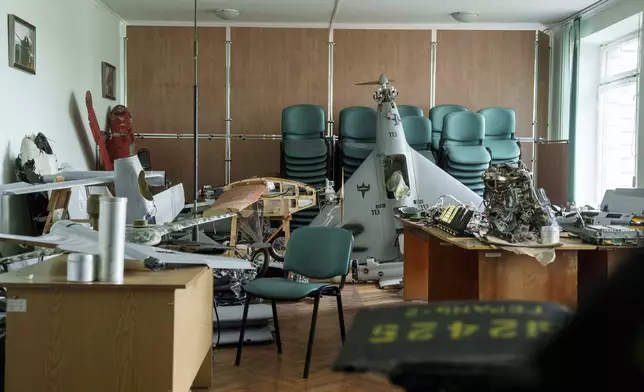 Parts of downed Shahed drones launched by Russia are piled in a storage room of a research laboratory in Kyiv, Ukraine, on Aug. 28, 2024. (AP Photo/Evgeniy Maloletka)