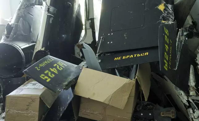 Parts of downed Shahed drones launched by Russia are piled in a storage room of a research laboratory in Kyiv, Ukraine, on Aug. 28, 2024. (AP Photo/Evgeniy Maloletka)