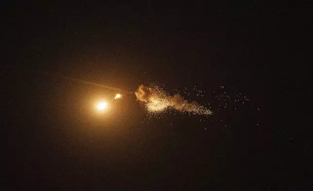 FILE - Ukrainian air defenses intercept a Shahed drone during a Russia aerial attack on Kyiv, Ukraine, on Saturday, Sept. 7, 2024. (AP Photo/Evgeniy Maloletka, File)