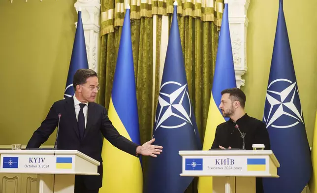 FILE - NATO Secretary General Mark Rutte, left, and Ukrainian President Volodymyr Zelenskyy, speak to journalists during a news conference in Kyiv, Ukraine, on Oct. 3, 2024. (AP Photo/Evgeniy Maloletka, File)