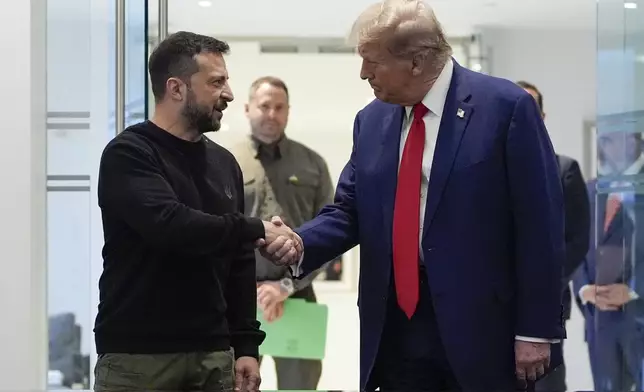 FILE - Republican presidential nominee former President Donald Trump, right, and Ukraine's President Volodymyr Zelenskyy shake hands during their meeting at Trump Tower, on Sept. 27, 2024, in New York. (AP Photo/Julia Demaree Nikhinson, File)