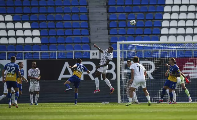 Christian Bilovar of Dynamo Kyiv watches as Benito of Zorya Luhansk, center, clears the ball during a soccer match of Ukrainian Premier League in Kyiv, Ukraine, Saturday Sept. 14, 2024. (AP Photo/Evgeniy Maloletka)