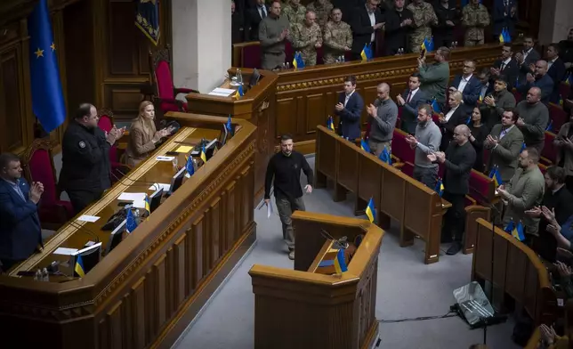 In this photo provided by the Press Service Of The President Of Ukraine on Oct. 16, 2024, Ukraine's President Volodymyr Zelenskyy arrives to speak to parliamentarians at Verkhovna Rada in Kyiv, Ukraine. (Press Service Of The President Of Ukraine via AP)