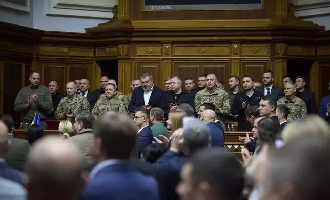 In this photo provided by the Press Service Of The President Of Ukraine on Oct. 16, 2024, Head of Ukrainian Presidential Office Andriy Yermak,left, Commander-in-Chief of the Armed Forces of Ukraine General Oleksandr Syrskyi, Lieutenant Generel Bargilevich Anatoly Chief of the General Staff of the Armed Forces of Ukraine, Oleksandr Lytvynenko Head of Foreign Intelligence Service of Ukraine, Maj. Gen. Vasyl Maliuk Chief of Ukraine's Security Service, Maj. Gen. Kyrylo Budanov, Ukraine's military intelligence chief, listen a speech of Ukraine's President Volodymyr Zelenskyy at Verkhovna Rada in Kyiv, Ukraine. (Press Service Of The President Of Ukraine via AP)