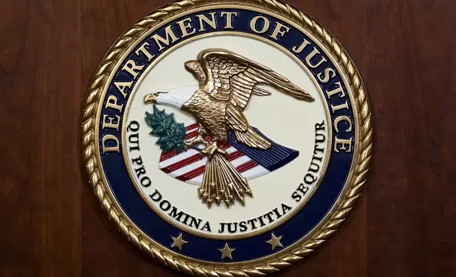 FILE - The seal of the Department of Justice, Aug. 1, 2023, at the Department of Justice in Washington. (AP Photo/J. Scott Applewhite, File)