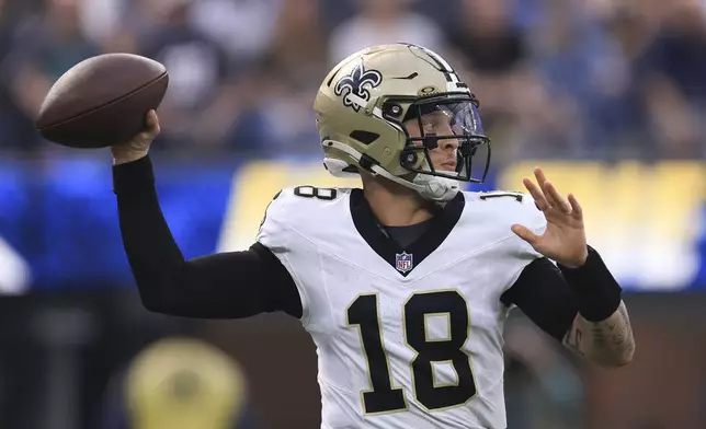 New Orleans Saints quarterback Spencer Rattler (18) passes in the first half of an NFL football game against the Los Angeles Chargers in Inglewood, Calif., Sunday, Oct. 27, 2024. (AP Photo/Ryan Sun)