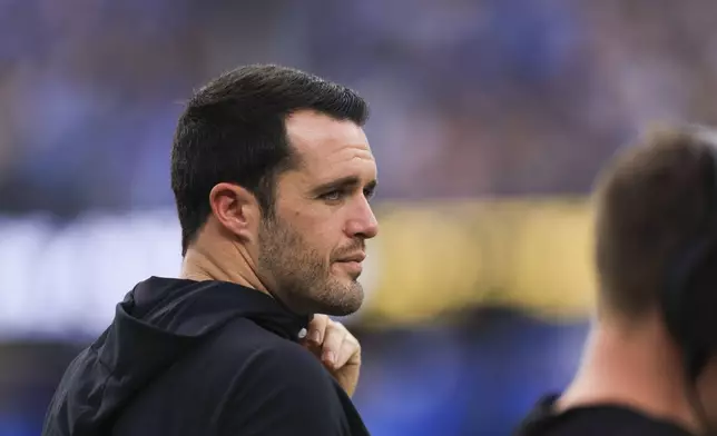 Injured New Orleans Saints quarterback Derek Carr watches from the sideline in the second half of an NFL football game against the Los Angeles Chargers in Inglewood, Calif., Sunday, Oct. 27, 2024. (AP Photo/Ryan Sun)