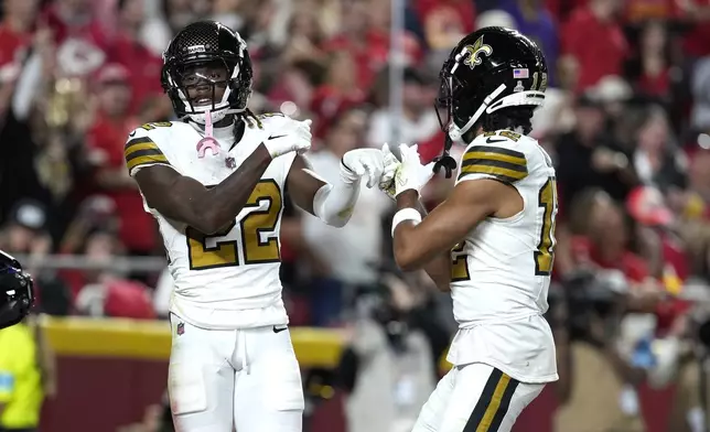 New Orleans Saints Rashid Shaheed, left, is congratulated by wide receiver Chris Olave after scoring during the first half of an NFL football game against the Kansas City Chiefs Monday, Oct. 7, 2024, in Kansas City, Mo. (AP Photo/Ed Zurga)