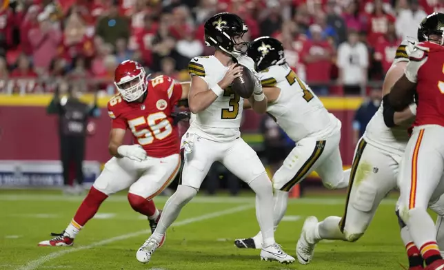 New Orleans Saints quarterback Jake Haener (3) drops back to pass during the second half of an NFL football game against the Kansas City Chiefs Monday, Oct. 7, 2024, in Kansas City, Mo. (AP Photo/Ed Zurga)