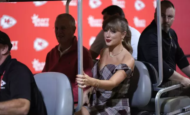 Taylor Swift arrives before the start of an NFL football game between the Kansas City Chiefs and the New Orleans Saints Monday, Oct. 7, 2024, in Kansas City, Mo. (AP Photo/Charlie Riedel)