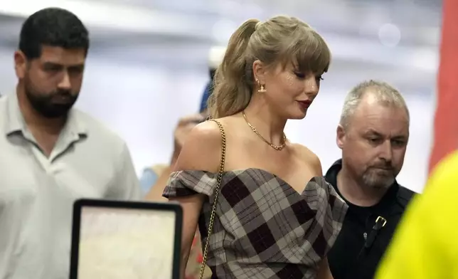 Taylor Swift arrives before the start of an NFL football game between the Kansas City Chiefs and the New Orleans Saints Monday, Oct. 7, 2024, in Kansas City, Mo. (AP Photo/Ed Zurga)