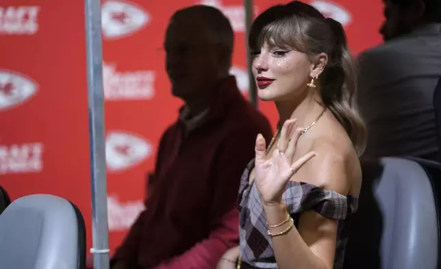 Taylor Swift arrives before the start of an NFL football game between the Kansas City Chiefs and the New Orleans Saints Monday, Oct. 7, 2024, in Kansas City, Mo. (AP Photo/Charlie Riedel)