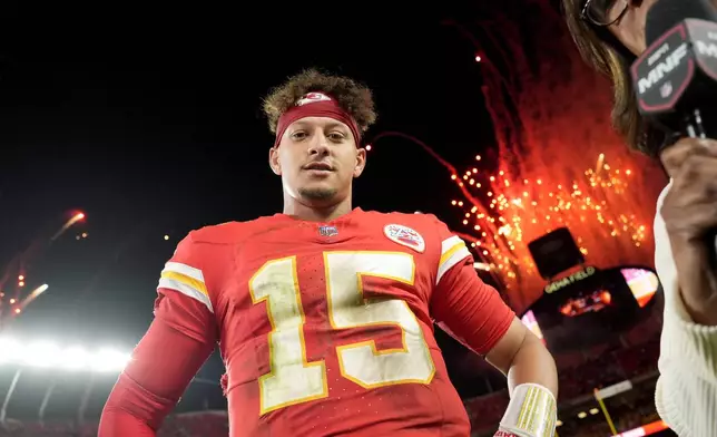 Kansas City Chiefs quarterback Patrick Mahomes waits to be interviewed following an NFL football game against the New Orleans Saints Monday, Oct. 7, 2024, in Kansas City, Mo. The Chiefs won 26-13. (AP Photo/Charlie Riedel)