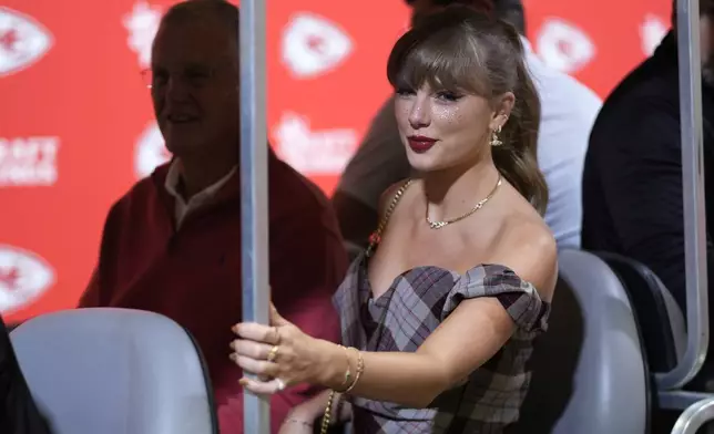 Taylor Swift arrives before the start of an NFL football game between the Kansas City Chiefs and the New Orleans Saints Monday, Oct. 7, 2024, in Kansas City, Mo. (AP Photo/Charlie Riedel)