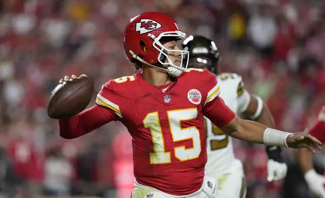 Kansas City Chiefs quarterback Patrick Mahomes throws during the first half of an NFL football game against the New Orleans Saints Monday, Oct. 7, 2024, in Kansas City, Mo. (AP Photo/Ed Zurga)