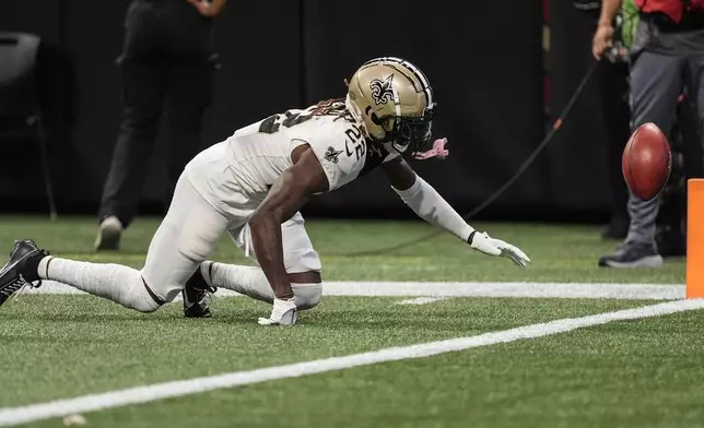 New Orleans Saints wide receiver Rashid Shaheed (22) fumbles a punt that leads to a Atlanta Falcons touchdown during the first half of an NFL football game, Sunday, Sept. 29, 2024, in Atlanta. (AP Photo/John Bazemore)