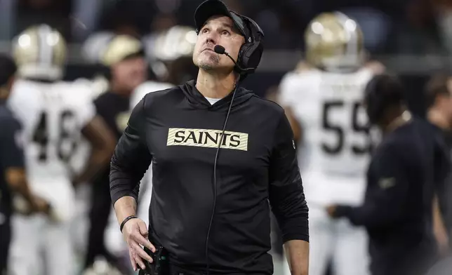 New Orleans Saints head coach Dennis Allen watchs a replay during the first half of an NFL football game against the Atlanta Falcons, Sunday, Sept. 29, 2024, in Atlanta. (AP Photo/Butch Dill)