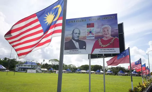 The Malaysian flags flies at their sponsored village of Lepea, the village of Samoa's first prime minister Fiame Mata'afa Faumuina Mulinu'u II and the current prime minister Fiame Naomi Mata'afa Lepea, on Sunday, Oct. 20, 2024, ahead of Commonwealth Heads of Government meetings starting later in the week. (AP Photo/Rick Rycroft)