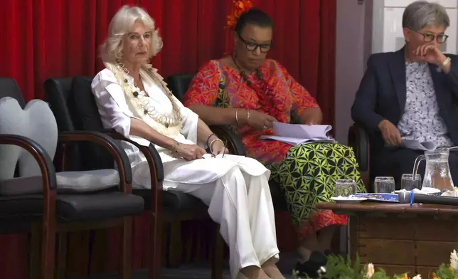 Britain's Queen Camilla, left, attends the Commonwealth Heads of Government Meeting (CHOGM) Women's Forum side-event in Apia, Samoa Thursday, Oct. 24, 2024. (Manaui Faulalo/Pool Photo via AP)