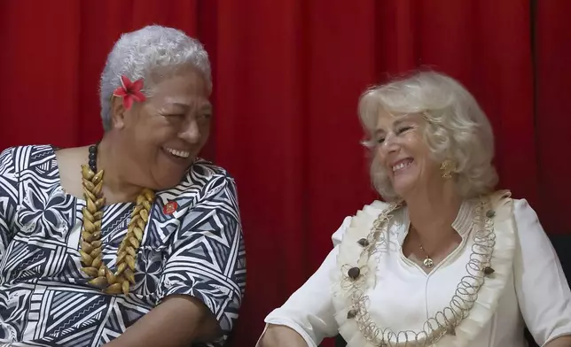 Britain's Queen Camilla, right, talks with Samoa's Prime Minister Fiame Naomi Mata’afa during the Commonwealth Heads of Government Meeting (CHOGM) Women's Forum side-event in Apia, Samoa Thursday, Oct. 24, 2024. (Manaui Faulalo/Pool Photo via AP)