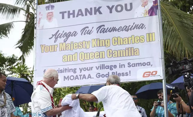 Britain's King Charles III, second left, visits the Mangrove Restoration Project at Moata'a Village in Apia, Samoa Thursday, Oct. 24, 2024. (Manaui Faulalo/Pool Photo via AP)