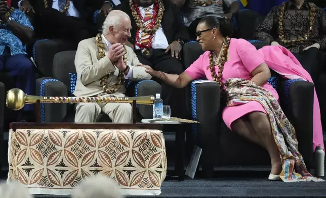 Britain's King Charles and CHOGM Secretary General Patricia Scotland talk during the opening ceremony for the Commonwealth Heads of Government meeting in Apia, Samoa, Friday, Oct. 25, 2024. (AP Photo/Rick Rycroft/Pool)