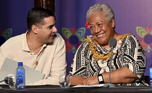 Malta's Minister of Foreign Affairs Ian Borg, left, and Samoa's Prime Minister Afioga Fiame Naomi Mata'afa attend the final press conference at the Commonwealth Heads of Government Meeting (CHOGM) in Apia, Samoa, Saturday, Oct. 26, 2024. (William West/Pool Photo via AP)