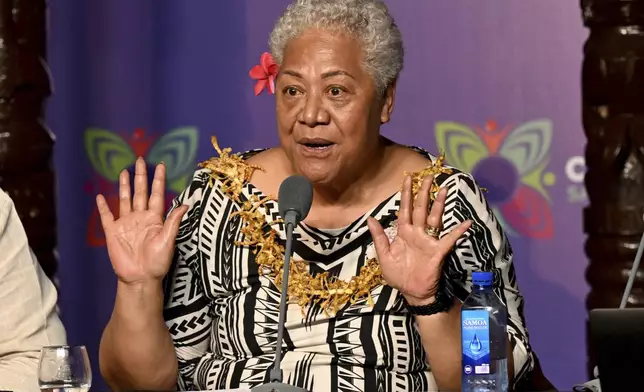 Samoa's Prime Minister Afioga Fiame Naomi Mata'afa addresses the final press conference at the Commonwealth Heads of Government Meeting (CHOGM) in Apia, Samoa, Saturday, Oct. 26, 2024. (William West/Pool Photo via AP)